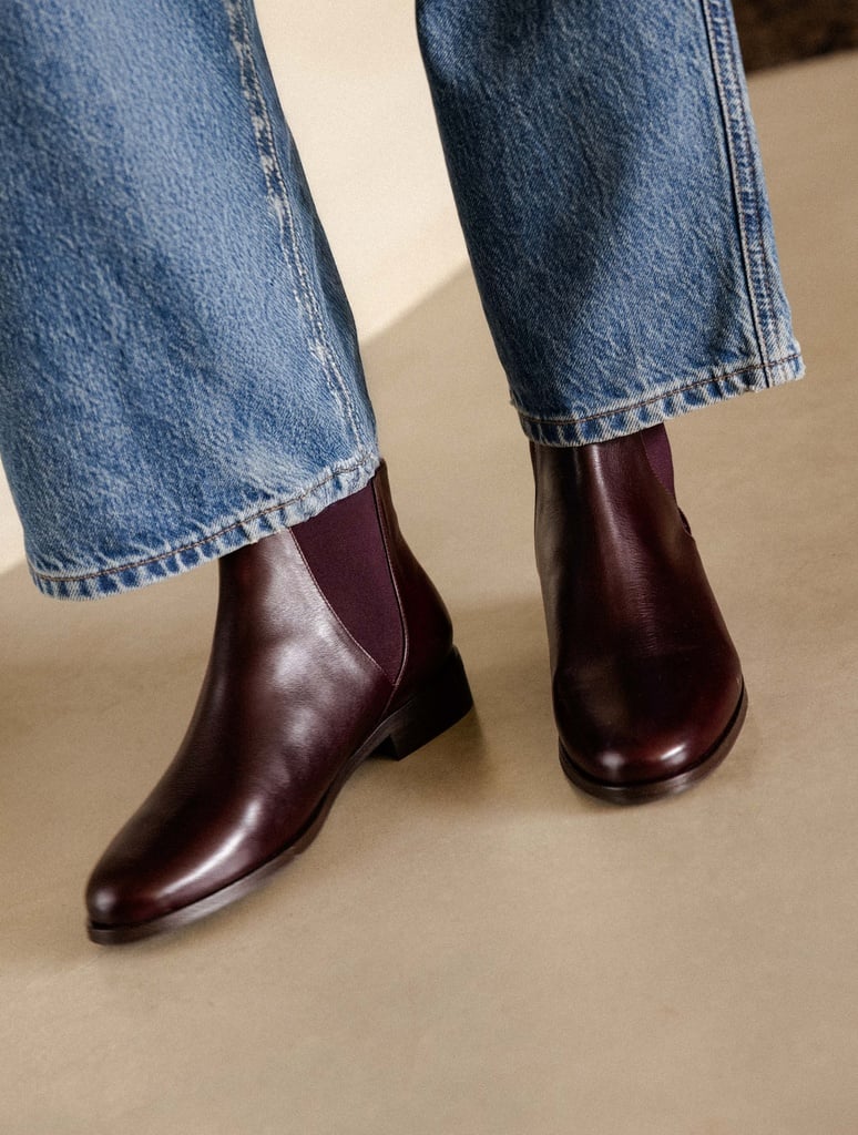 chelsea boots for women, pair of brown leather chelsea boots being worn with denim