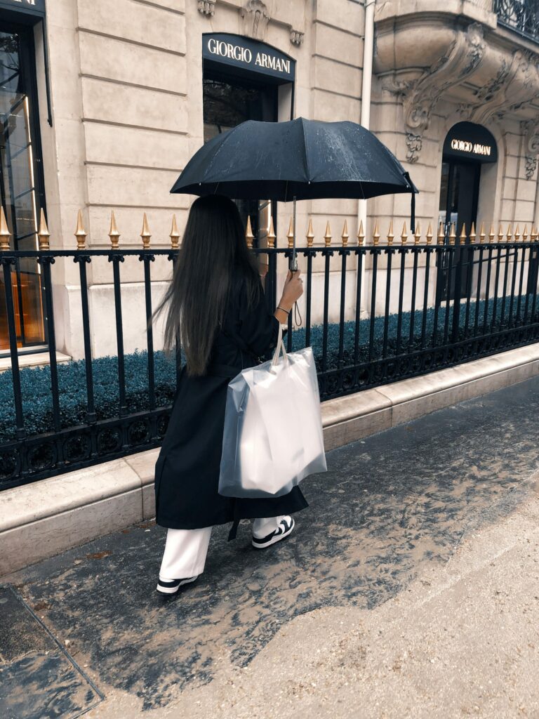 Weekend in Paris: 12 Simple Yet Smart Tips 3 woman walking in paris with umbrella while exploring weekend in paris
