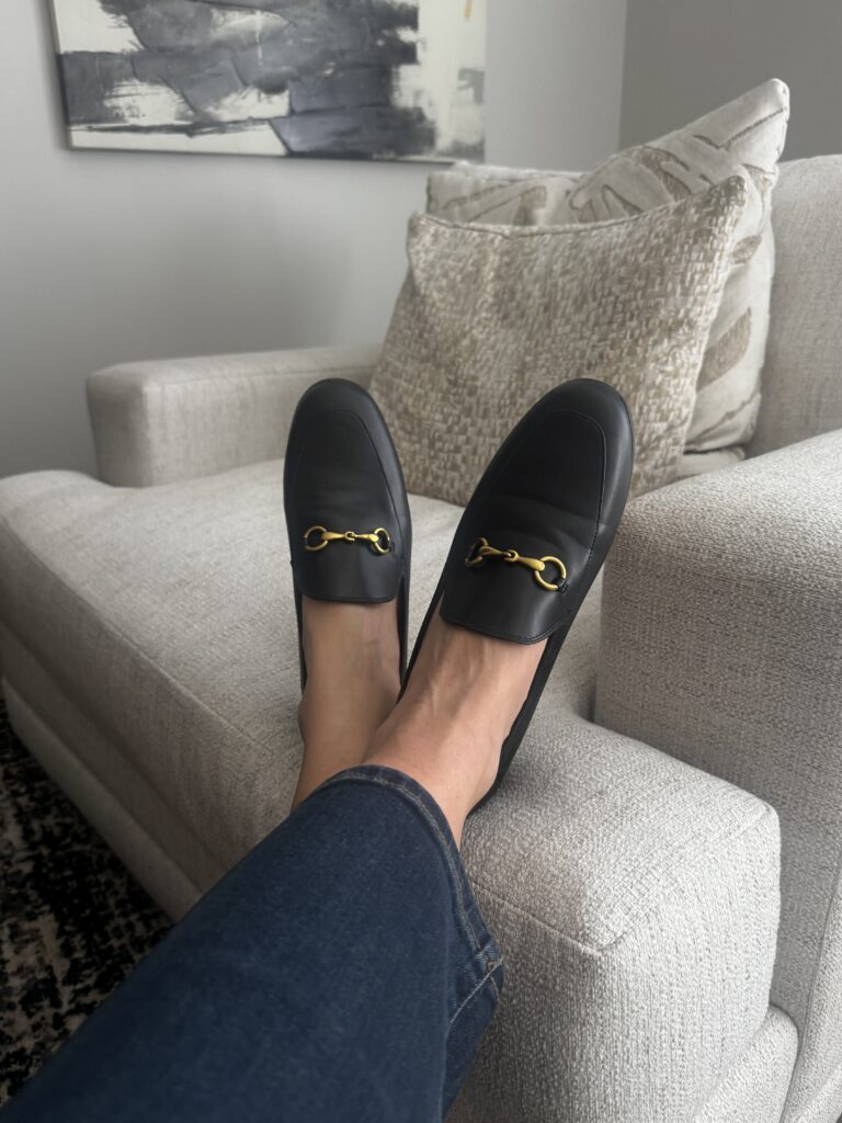 travel outfit ideas, woman wearing a pair of gucci laofers